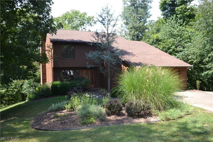 Here is Parkersburg's hidden treasure! Nestled in a beautiful wooded lot, this one-owner home has been lovingly maintained and is move-in ready. The first floor offers an eat-in kitchen, dining area, living room with wood fireplace, half bath, laundry and pantry area and a sunroom that overlooks the gorgeous view. Upstairs, you will find a large master bedroom with walk-in closet and master bath, 2 additional bedrooms, another full bath and storage space. The walkout basement includes an office that could be used as a 4th bedroom with a half bath, family room with fireplace and wet bar with barstools, a rec room with a pool table and unfinished storage space. Take in summer evenings on the gorgeous deck overlooking the private back yard. Storage building and garage complete the property!