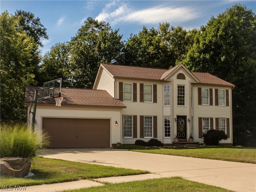 Rare opportunity to own a home in the highly sought after TALLMADGE HILLS PH III on a cul de sac with a walk out basement! Colonial home with 4 bedrooms, 3 full baths & half bath for total of 4 bathrooms! Large deck from rear of home overlooking the large serene, private rear yard since it is on a cul de sac! The lower level is fully finished with a media room, 2nd family room, full bar & 2nd kitchen, full bath with large shower and lower level has plenty of room for recreation tables then walk out thru lower level sliding glass doors to the rear patio & back yard! The main first floor has 2 Story Foyer flanked by the formal Living Room and Dining Room, Hall with Half Bath, huge Eat-In Kitchen with sliding glass doors to large rear deck, Family Room with fireplace and the 1st floor is rounded out by the Laundry Room. The second floor overlooks the foyer by way of a small loft that leads to the well proportioned Master Bedroom with Vaulted Ceiling and Large Master Bath & Walk In Closet!