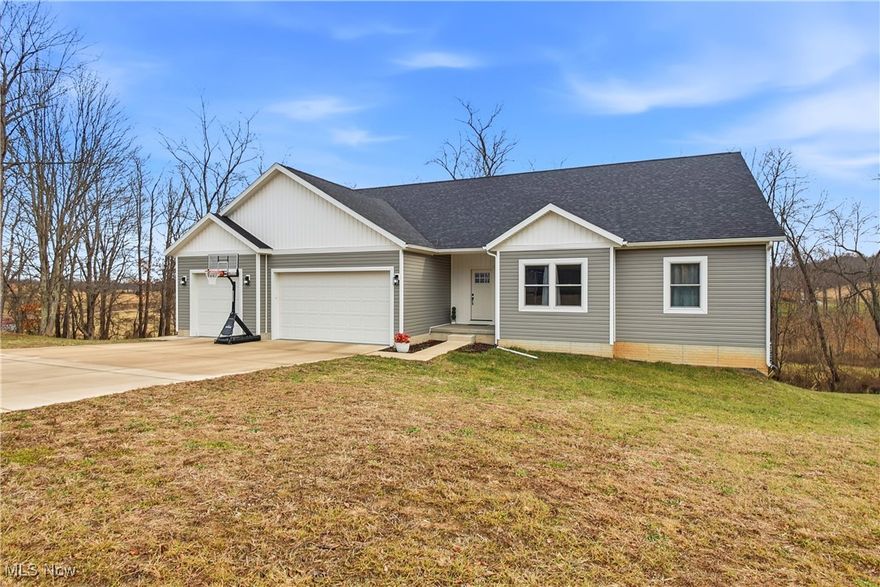 Welcome to this exceptional custom-built ranch in the highly sought-after Corbin Heights neighborhood, where elegance meets everyday comfort. Set on 1.18 beautifully maintained acres, this home features an open-concept layout with soaring vaulted ceilings designed for both entertaining and relaxed living. The stunning eat-in kitchen serves as the centerpiece of the home, showcasing new stainless-steel appliances, granite countertops, and a striking 12-foot center island. It opens seamlessly to the inviting living room, creating a warm and spacious gathering area.

The expansive primary suite offers a private retreat with a walk-in closet and a spa-inspired bathroom complete with a tiled walk-in shower featuring a Bluetooth speaker and a double-sink vanity. A well-appointed in-law suite includes its own private bathroom and generous storage, ideal for multi-generational living or guest accommodations.

Additional features include first-floor laundry, a fully finished walk-out basement that was completed in the Fall of 2025 and includes plumbing for a half bath, a covered back deck perfect for outdoor enjoyment on both the main and lower levels, and a three-car attached garage. With upscale finishes, thoughtful design, and plenty of room to grow, this remarkable property truly feels like home.