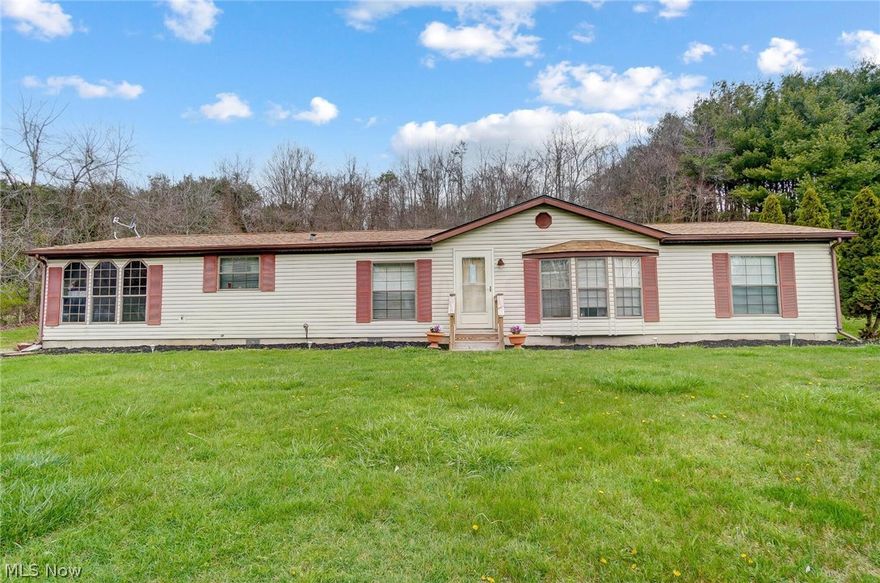 Home sits on over an acre and has ton of potential! Back yard is fenced great for dog lovers. Above ground pool and hot tub. Covered Deck great for sitting outside without an overload of sun. Kitchen has oak cabinets and vinyl flooring. New carpet in family room. New roof 2020 and new HVAC 2020. Home was reinsulated, very energy efficient. larger electrical, plus panel out in the oversized garage. No neighbor to the right adding additional privacy!