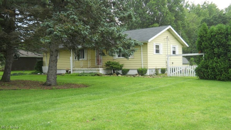 Looking for a country setting but still be close to it all?...Then check out this lovely ranch sitting on 1.41 acres with large heated detached garage with shop area, above ground pool, hot tub, lots of deck area and additional out building.  This 3BR/1and a half BA ranch is only minutes to the GM factory in Lordstown.  Inside you will find a large added on back porch leading into a nice open kitchen.  Large bathroom and 3 bedrooms will give your family plenty of living area.  Home has an oil furnace, with electric back-up heat.  Garage has heat, electric, and water.  Come out and see this pleasant ranch for yourself!  Great starter home or home for retirement.  SMOKE FREE HOME.