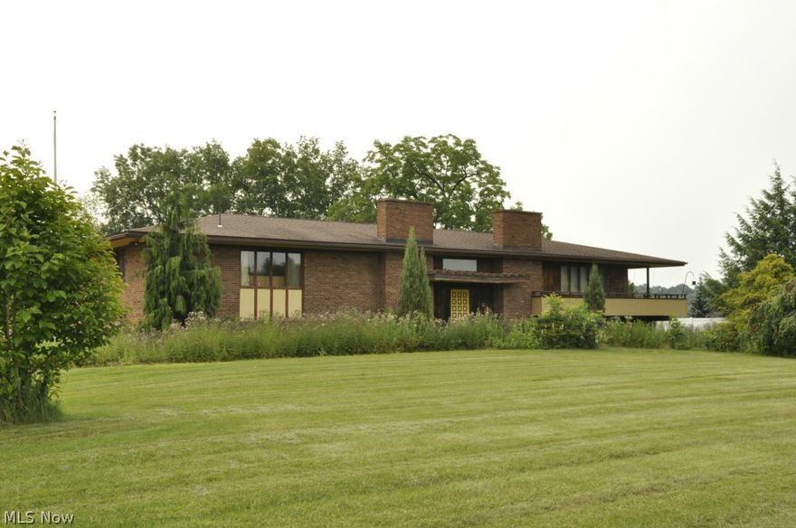 For many years this property has commanded an attention grabbing location on the western edge of Berlin Village.  Adjacent to both newer residential and commercial development the property is primed with multiple possibilities.  The property is comprised of a raised ranch home built in 1970 with approximately 3,800 square feet of living space along with a two car garage. Mechanics of the home are comprised of gas heat, central air, city water and sewer.  The property also includes a bank barn.  The improvements rest on 6.223 acres of land that is rolling and provides a hilltop location overlooking area.  The home has not been updated represents a large amount of living space. It is comprised of four bedrooms with the potential for additional bedrooms, kitchen, formal dining room, living room, large den, office and other assorted rooms.  Exterior of the home features two patios and second story deck. The property includes a 20 foot easement for ingress and egress to US Route 39/62.   Th