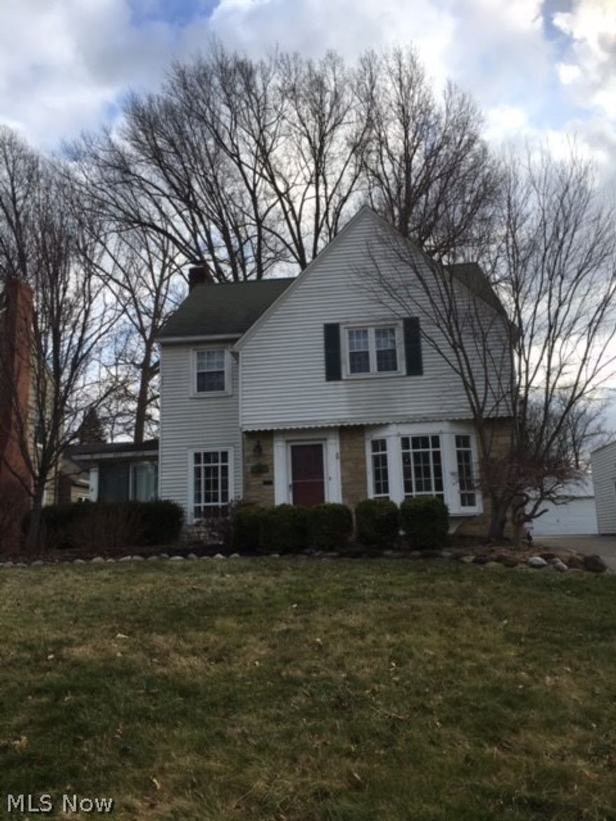 Beautiful Storybook home on sought after street. Fireplace in living room. Enclosed sun porch. Attached 2 car garage. Many new windows. C/A. Fenced in back yard.