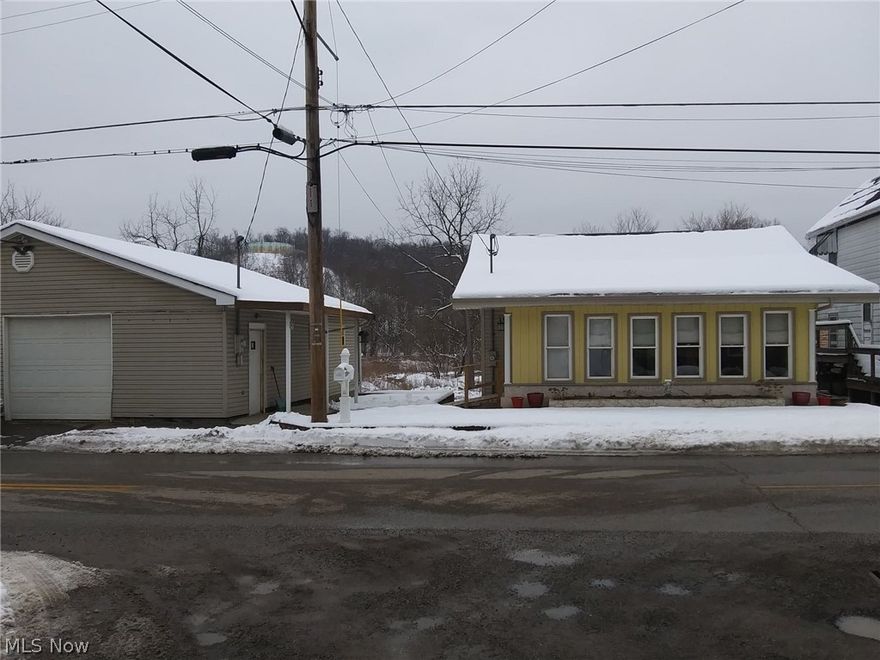 This cozy, well-kept home is just waiting for its new owner!  Upon entering, you will notice the sunroom, which is perfect for relaxing and drinking your morning coffee.  Through the french doors is the open concept living/dining/kitchen area which features newer laminate flooring throughout.  The kitchen has plenty of cabinet and counter space and also has a pantry.  The laundry room is conveniently located off of the kitchen.  There are two nice-sized bedrooms, one of which features a walk-in closet.  Downstairs is a full basement including a one car garage.  There is also a 2 car detached garage which also has electricity, a workspace area, and 2 additional rooms off the garage which could be used as a hobby room, extra storage, etc. There is also a storage shed located beneath the detached garage.  Located on over 1/3 of an acre which allows for endless possibilities for entertaining.  Conveniently located within minutes from shopping and dining.  Call and schedule your appointment