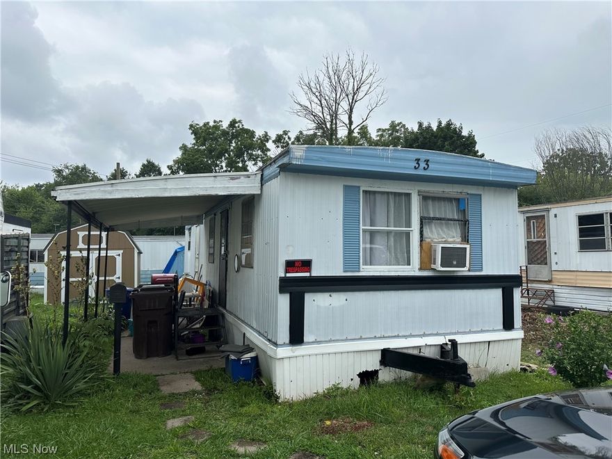 Looking to downsize? This Perry Township mobile home that has been recently updated throughout. Enjoy cooking in the kitchen that offers new kitchen cabinets with plenty of storage & appliances included. Relax in the living room that has new carpet & has been freshly painted. Throughout the hall way, kitchen & living room there has been new drywall installed prior to painting. New flooring throughout the entire mobile home has just been installed. Enjoy the updated bathroom that has a newer shower & toilet. Organize your personal belongings in the bedroom that has a new closet organizer. The seller has made an area to have a washer/dryer hookup & are included with the purchase. Electric & plumbing have been updated. The roof was recently coated. Utilize the shed that comes with the property, great for outside storage. Enjoy your morning coffee on the front covered patio. Everything has been done, so you can move in, unpack & enjoy making this your home sweet home.