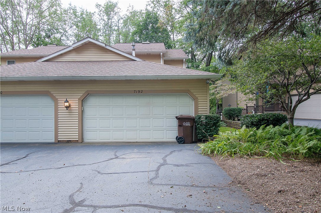 This two-bedroom, one and a half baths condo is located in Jackson Township, nestled in a beautiful private wooded setting off Hills & Dales rd. With a walking path and park-like views. The eat-in kitchen offers appliances, a tile backsplash, a dinette area, and convenient access from the garage to carry your groceries; it also has an opening to the dining room. The inviting living room with access to the balcony/deck overlooking the beautiful backyard setting is perfect for relaxing with a cup of coffee/wine. Upstairs has two bedrooms, including the master's with spacious closets. The master bedroom has private access to the full bath (with tile surround shower/tub, tile counter/vanity, and a skylight). The lower level is partially finished and offers a family room/rec room with a walkout to a private concrete patio; there is also a craft room, a laundry area, and plenty of storage space. Enjoy the ease of condo living while being in a great location. This maintenance-free condo is av