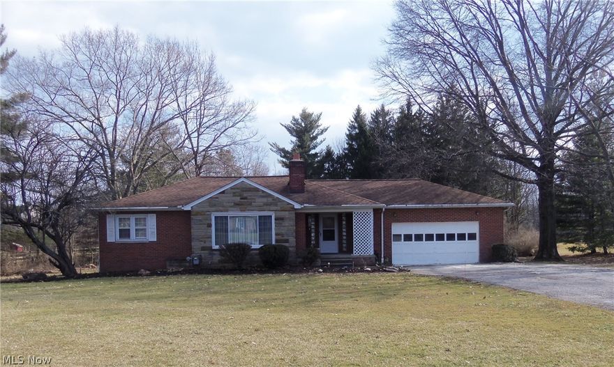 Move Right In! Nice 2/3 Bedroom Ranch with 2 Car Attached Garage. Beautiful Park-like Setting on 1.72 Acres.  Spacious 32x40 Pole Barn with Electrical & Cement Floor.  Updated Kitchen with Wood Cabinets, Pantry, Dishwasher, Newer Cooktop & Oven, Newer Countertops, Backsplash, Corian Double Sink and Ceramic Tile Flooring. Nice Sunroom with Crank Out Windows, Ceiling Fan and Door out to Backyard.  Front Entryway with Slate Tile Flooring & Large Coat/Cedar Closet. Inviting Living Room with Wood Burning Fireplace, New Carpeting in Dining Room and Hallway. Two Bedrooms with Nice Hardwood Floors, Finished Room in the Basement Used as a 3rd Bedroom. Basement Has lots of Storage Space & Has Been Waterproofed with a Lifetime Transferable Warranty. Younger House Roof w/ 30 year Shingles, Updated Vinyl Windows,100 Amp Electric Box, Hot Water Tank, Well Maintained Furnace & New Garage Opener. Great Location, Easy Access to Shopping and Highways, Solon Top Rated Schools. Call Today!!