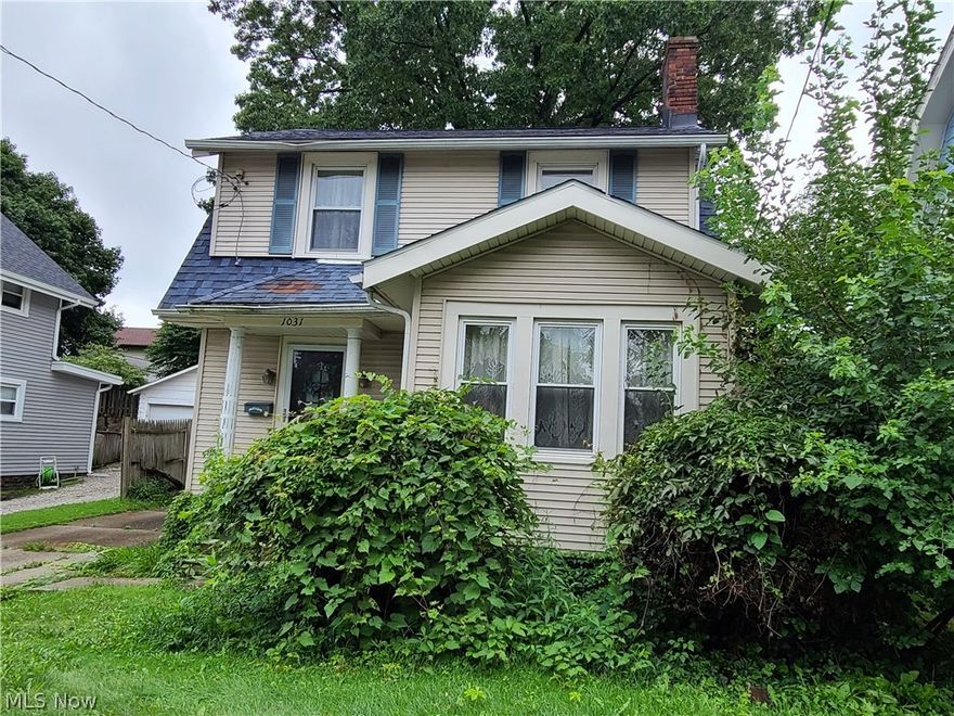 1031 Oakland Ave Akron OH 44310 with 3 bedrooms & bath on 2nd floor, large Living Room with beautiful hardwood flooring & fireplace flanked by 2 windows & built ins, Sunroom looking over the front yard, Dining Room with window seat for plenty of seating for those holidays or at home schooling & Eat-In Kitchen with plenty of room for kitchen table and direct access to rear porch & back yard all on the 1st floor. The back porch opens to a private rear yard & the 1 car detached garage. The bones and exterior of this home are in good shape but needs some maintenance on the landscaping. There have been some expensive updates in the near past including the newer Central Air conditioning & the High Efficient Furnace, newer Hot Water Tank, glass block windows and newer dimensional shingled roof. Large tree was removed from the front yard & repair completed from the tree however the home does need Tender Loving Care since past owner lived in the home for many years. The bathroom still has the o