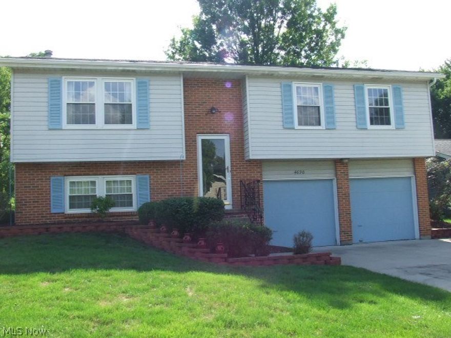 Great Bi-Level, bigger than most with additional rooms.  3-4 bedrooms, large living room open to formal dining room, appliance eat-in kitchen, 1st floor family room with firelace and custom made bookcases and slider leading to deck. Lower level includes possible 4th bedroom or office, rec room, half bath, laundry room, and walk-out to attached 2-car garage with extra wide driveway.  Gorgeous corner lot with several bricked flower beds and large shed with cement floor.  Waiting for your decorating touches, this could be your fabulous new HOME!  Home Warranty.  Call today for private showing.