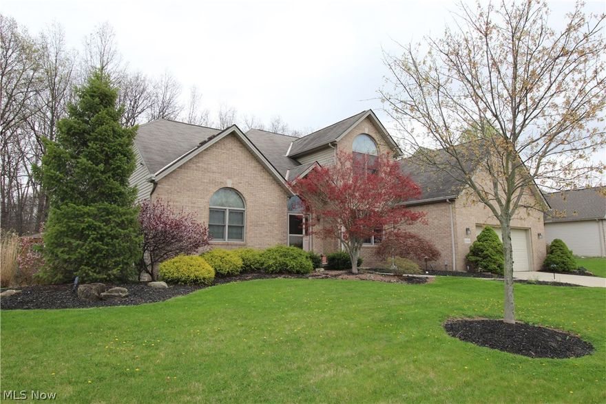 Welcome to this beautiful FOUR Bedroom and FOUR Bathroom Open Floor Concept Brick Modern Contemporary.  Foyer leads to a first floor office and a breathtaking Two Story Vaulted Great Room featuring Arch Windows And Fireplace.  Open and spacious dining area and Kitchen with Slider to and expansive elevated Deck with attached Gazebo overlooking the private wooded lot. First Floor Master with Vaulted ceilings, private slider to the deck and gazebo, and Glamour Bath, 2 Bedrooms Upstairs with Full Bath, and 4th Bedroom Downstairs with Full Bath. EXTRA LARGE Full finished recreation room in basement with a bar area, media area, Full Bath, and dedicated storage area. First floor laundry room. Must see.