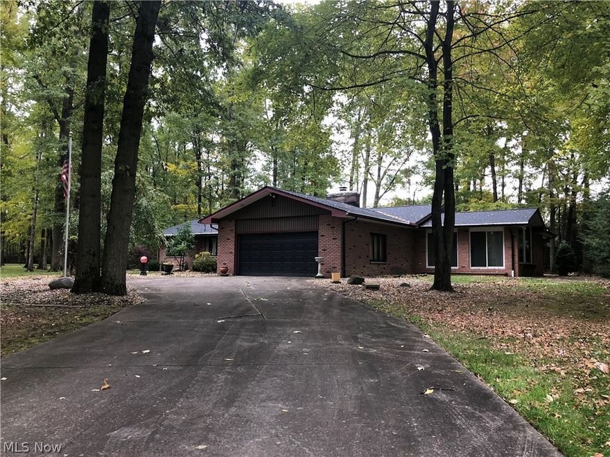 Set up an appointment to view this sprawling all Brick Ranch in Howland Township! This house has been incredibly well maintained over the years and offers many great amenities. The house sits on a great wooded lot with almost an acre of land. Some of the great updates include a spacious addition with vaulted ceilings, 32 foot trapezoid window and a large additional full bathroom. Some additional features include: Kitchen with corian counter-tops, ceramic tile flooring,  and Jenn-air appliances. Just off the Kitchen there is an extended Front Room with a full wall stone fireplace, Formal Dining Room and Sunken Great Room with wood beamed ceilings that extends to a 3 season room off the back of them home. The first floor continues through the Foyer down a hall leading to 3 Bedrooms including a spacious Master-suite with en-suite Bathroom. The lower level includes even more finished living space and tons of storage! The basement features a full additional living suite including a bonus Be
