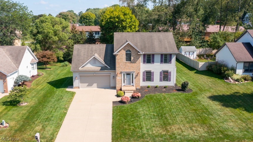 This meticulously maintained, one owner, 4 BR, 2.5BA home located on a quiet cul-de-sac in Perry LSD is situated on a beautifully landscaped lot. The decorative brick front stoop walks you into the welcoming foyer w/hardwood flooring & dual coat closets. The FR w/ built-in speakers (receiver conveys), light washed brick gas f/p (electronic start direct-vent), oak hearth & oak ledge pillars open to the DR w/ bowed window, crown molding & chair railing. The kitchen includes pantry, in-ceiling speakers, dinette w/slider & steps to the patio, overlooking the lush grass backyard. 1st fl laundry w/ gas/electric dryer hookup, window & built-in shelf, half bath w/ pedestal sink off the foyer & door to the oversized garage w/utility sink/door & bump out for extra storage. The 2nd floor hosts the master suite w/ cathedral ceilings, full bath w/ linen closet & large walk-in closet. The other 3 bedrooms/bonus room include double closets & share the 2nd full bath. The 12-course full basement has 4