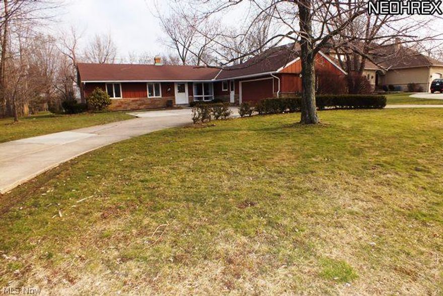 Beachwood Ranch with circular driveway sits on a gorgeous picturesque lot. Deck on rear and back patio. Gorgeous yard! Hardwood floors throughout most of the home, large picture windows, 3 or 4 bedrooms (smaller one off laundry room can be an office) Master has it's own bathroom. Large Kitchen has double sinks and is eat-in. Attached two car garage, central A/C and lower level partially finished basement. First floor laundry room. Newer furnace and hot water tank. Sought after location close to shopping, places of worship, and easy freeway access!