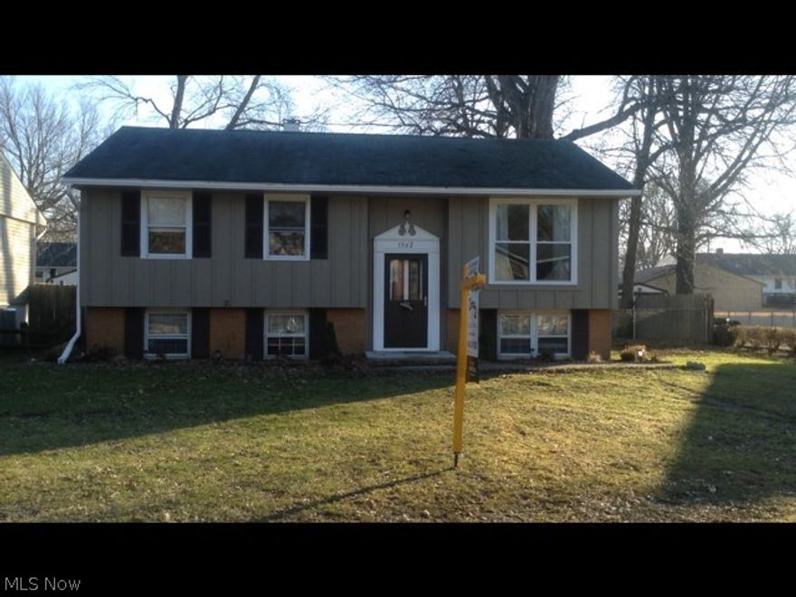 3 BR Bi Level beautifully redone throughout. New doors, windows and counter tops. Hot Water tank and Furnace are new with air purifier and AC coil installed...need to add AC unit if desire central air. Updated electrical. Flooring includes laminate and porcelain tile. All new lighting and fans. Freshly painted inside and out.  New wood deck.