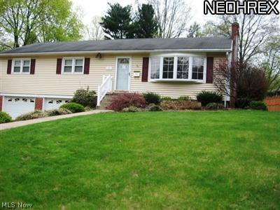 Nice Ranch home on a beautiful large lot, close to schools and the YMCA. Newer carpet, vinyl in kitchen, and wood laminate floors in living room and dining room. Freshly painted throughout. Replacement windows, central air, and attached 2-car garage. Lower level partially finished. Turn the key and move in. Call for a private tour today!