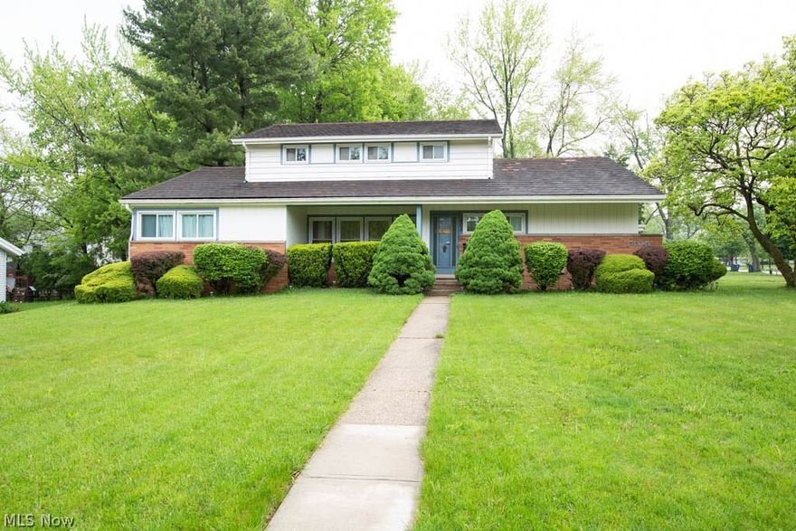 Large 5-bedroom Forest Hills colonial with 1st floor master suite and additional 1st floor bedroom. Three more bedrooms plus bonus room on 2nd floor. Beautiful wood floors in all bedrooms, living room, dining room, and family room. Nice covered porch in back of the house. 1st floor laundry/mud room. Kitchen has eating area plus breakfast counter and built-ins. All bathrooms recently updated. Two car attached garage. This home has a lot of charm and a lot of space. If you are looking for a larger home with first floor living plus a second floor and basement, this is a must see! The main roof is Ludowici Clay Tile,