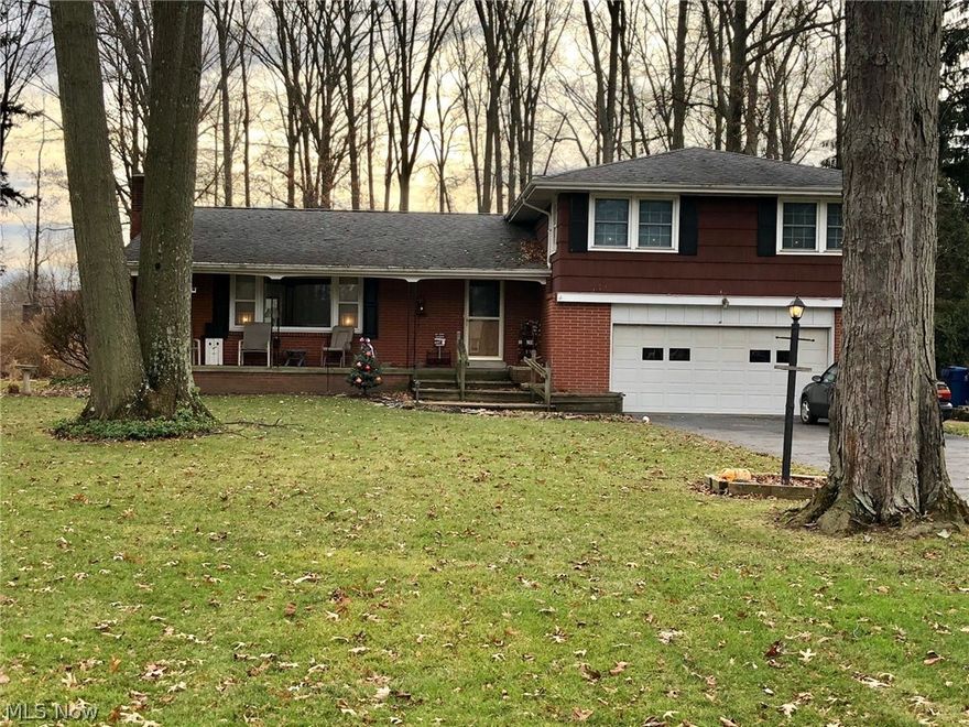 This great split level is ready for new owners!  This spacious 3 bedroom 2 1/2 bath home sits on large wooded lot along a quiet dead-end street in Howland Township.  Kitchen open to formal dining room.  Large living room with wood burning fireplace.  Upstairs offer 3 bedrooms with a full bath and large master bedroom with his and hers closets and master bath with shower.   Upstairs carpet can be removed to reveal hardwood floors.  Lower level with family room or possible 4th bedroom that opens to large brick patio. Enjoy summers on the deck with plenty of space for entertaining or just relaxing around a fire pit.  Perfect yard to create your own mystical space.  If you like gardening there are 3 enclosed planters complete with aged organic soil.  This home offers the best of both worlds with its county living feel but minutes from schools, shopping and highways.