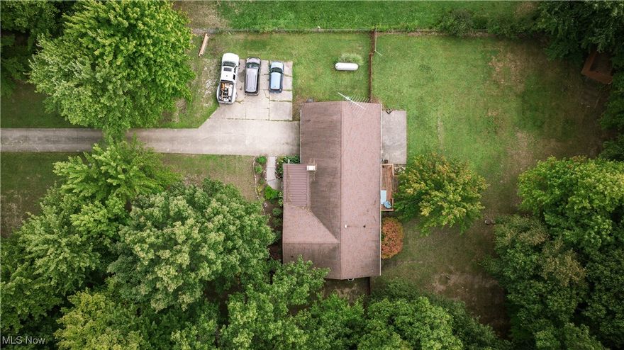 Charming log home on 2 secluded acres, located in Lodi. This home features 3 bedrooms 2 bathrooms, and sits just under 1500 square feet. Enjoy the serenity of nature from your front or back porch or enjoy a quiet night beside the fire pit. Inside you will find cathedral ceilings in the great room and a cozy wood burning fireplace. The basement is partially finished with a large library/media room, as well as a half bath. Attached two car garage with a large storage shed that conveys with the property. Conveniently located in I71; Cloverleaf Local Schools