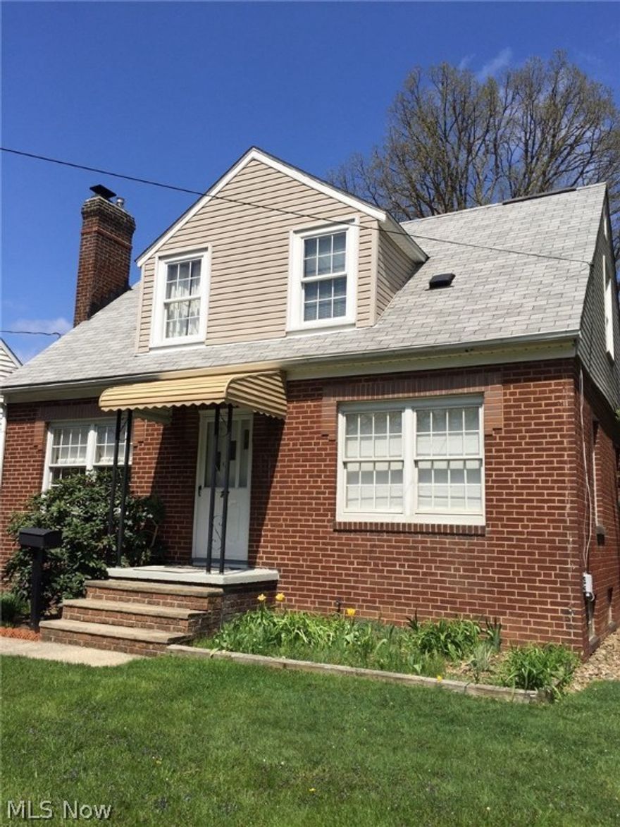 Beautiful tree-lined streets lead you to this charming cape cod home in Ellet. Visit this well cared for home that backs into Davenport Park. The home has three bedrooms with one of the bedrooms on the first floor. There is a bathroom on the first and second floor. You will find a designated dining room next to the kitchen. All appliances stay including the washer and dryer. The living room has a lovely fireplace to warm a cold night. There are newer windows throughout the house and there are hardwood floors under all the carpeted rooms. The basement is partially finished and has a built in bar. For your enjoyment you will find a back porch screened-in sunroom. You will also find a newer roof, outside doors, refrigerator, furnace, water heater, insulation, carpet, linoleum, bathtub, air conditioning, and freshly painted inside. The owner is offering a one year home warranty. Start new memories in this ready to move-in home.