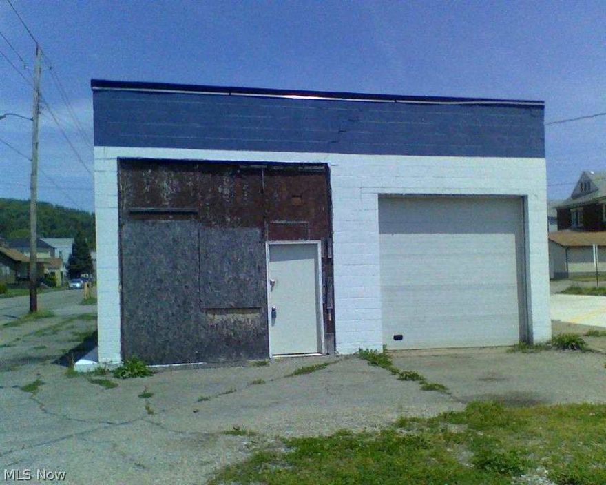 PRICE COMMERCIAL LOCATION IN CENTER OF TOWN. 2 BUILDINGS. 12 PARKING SPACES. 12 FOOT DOORS. HAS A MULTITUDE OF USES!
