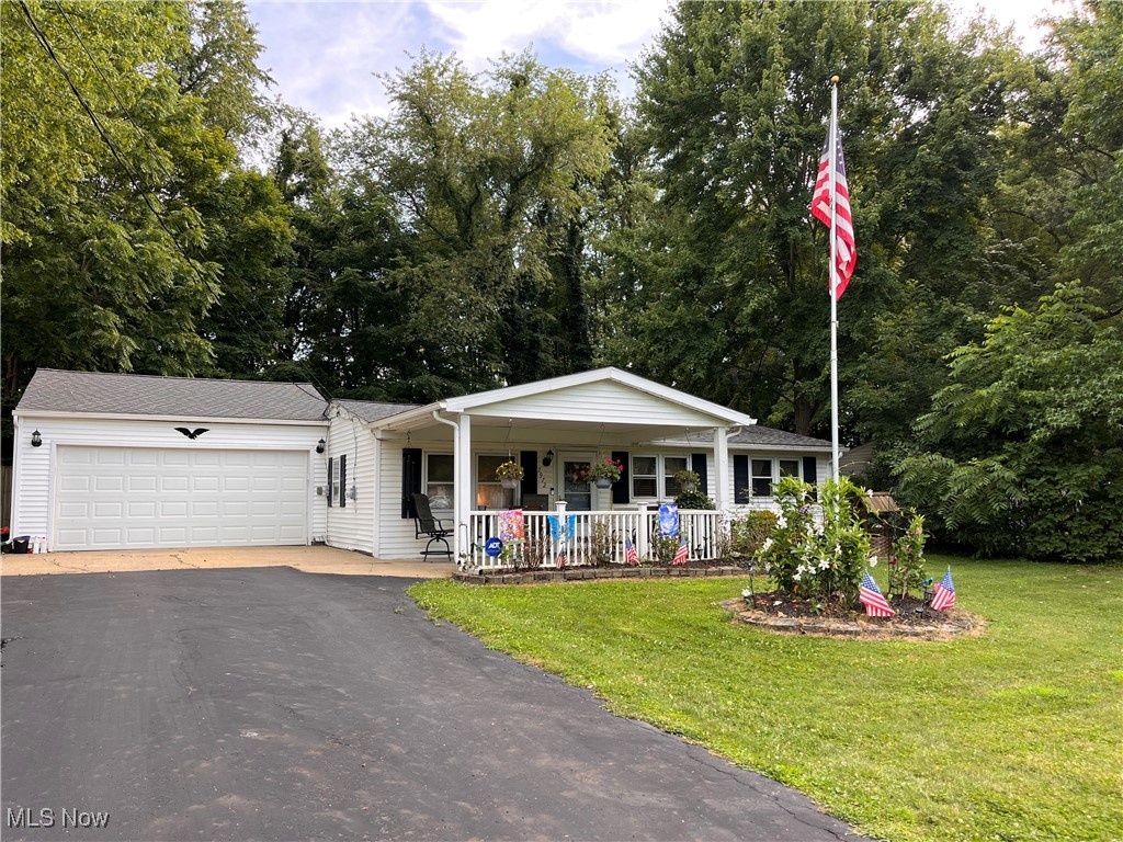 Truly a place you can call home! Lovely turn-key Ranch with 2 Car Garage. Currently 2 Bedrooms but easy to restore to 3 Bedrooms. Inviting 12x18 Front Porch to enjoy cool summer nights overlooking newer front lawn. This Home has been Meticulously maintained with the following: 2011 New 100' Well. In 2022 new Furnace, AC, Hot Water Tank, Kitchen & Bathroom floors. Also, in 2022 New Roof on House, Garage, Workshop and Shed. Large Workshop is (33x16) perfect for Woodworkers, Crafters or any Hobby you may have. Workshop and Garage have 220V. This home includes Refrigerator, Stove, Garage Freezer, Washer and Dryer. Total peace of mind including a Home Warranty. Why pay rent when you could own this amazing home.