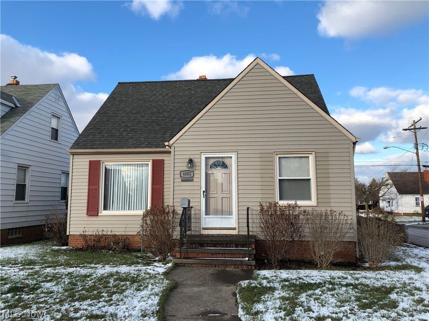Darling 3 bedroom Bungalow, freshly painted and brand new carpet in bedrooms and living room. You can see your reflection in the hardwood floors of the Eat-in kitchen. Newer white washed custom cabinetry and newer kitchen appliances. Updated bath. New laminate wood flooring in the sun room. Carpeted basement recreation room. Two car garage with attic storage space and electric garage door openers. Microwave, refrigerator, as stove and dishwasher included installed in 2014. Washer and dryer included. Nice three seasons sun room accessible through one of the bedrooms. Furnace replaced in 2015.  Home Warranty Included in purchase. Call for private showing today, we know you'll like it here!