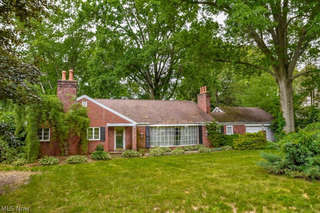 Tons of potential in this 3 bedroom, 2.5 bath brick ranch in Charity Rotch! 3,700 square feet on half an acre! Every room is simply enormous, the square footage really works to give you the most space in each room. There’s an expansive bowed window in the living room as well as a fireplace. Second fireplace in the family room. The eat-in kitchen has huge windows overlooking the backyard. Off of the kitchen is a large laundry room with a half bath and access to the front, back and garage. First floor master suite at the end of the hall with 2 closets and a private full bath. Bedroom 2 across the hall plus a full bath. Upstairs offers an enormous finished bedroom with a dressing area. 2-car attached garage with above attic storage. Backyard has a paver patio. The home needs work but the space is there. Selling As Is, no repairs. Schedule a private showing today!