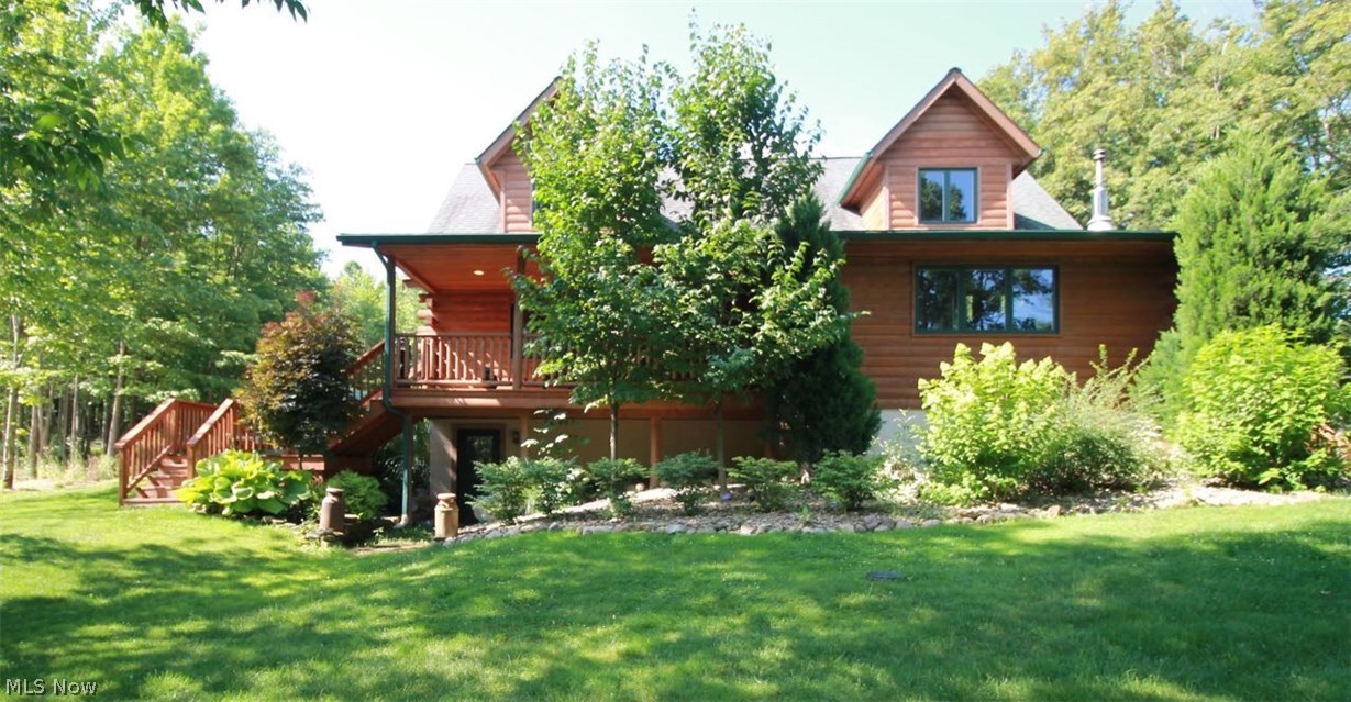 One of a kind gorgeous cedar log cabin tucked away on a large private drive on over 5 secluded acres. Open concept with lots of natural light on the main floor. Hickory kitchen has plenty of counter and cabinet space. The custom countertops are Granicrete with all newer stainless steel appliances to accent this gorgeous kitchen. Stunning cathedral ceilings, and a great room w/stunning wall of windows and double sliders to access the large deck and enjoy the lush landscaping and wooded ravine. There is also a loft upstairs for you to tuck yourself away and relax or use for a kids play area. The large master retreat with knotty pine flooring offers a nice walk-in closet; master bath and a sitting area for your relaxation. Backyard offers two separate area for entertaining and enjoying the day. Fenced area is great for pets or children, and the rear back and side yard wide open with lush flower gardens and open space. Front pond has been dug out and rockfall just needs some finishing u