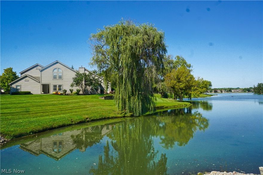 Enjoy the serenity, of LAKEFRONT living, in this stunning 3 bedroom, 2 1/2 bath condo. Located in the Back Bay at Arrowhead Development, which features beautiful landscaping, sidewalks, streetlights, and a gazebo. Spacious, open floor plan with a fantastic view of the lake!  Great room includes living/dining combo with vinyl flooring, new baseboards, and a see thru fireplace, shared with the sunken sunroom with an awesome lake view! Updated kitchen with granite counters, newer cabinetry, glass backsplash, vinyl flooring, recessed lighting, breakfast bar, pantry, and appliances. Wake up in the morning, in the first floor master suite, and see the beautiful lake views!!  Bedroom has a private entrance to the patio, walk-in closet, and a luxury bath with a ceramic step-in shower. Convenient 1st floor laundry is attached to the master bath/bedroom. There are two additional bedrooms on 2nd floor and a large loft with cabinetry, mini-fridge, and wet bar.  Relax on the brick paver patio overl