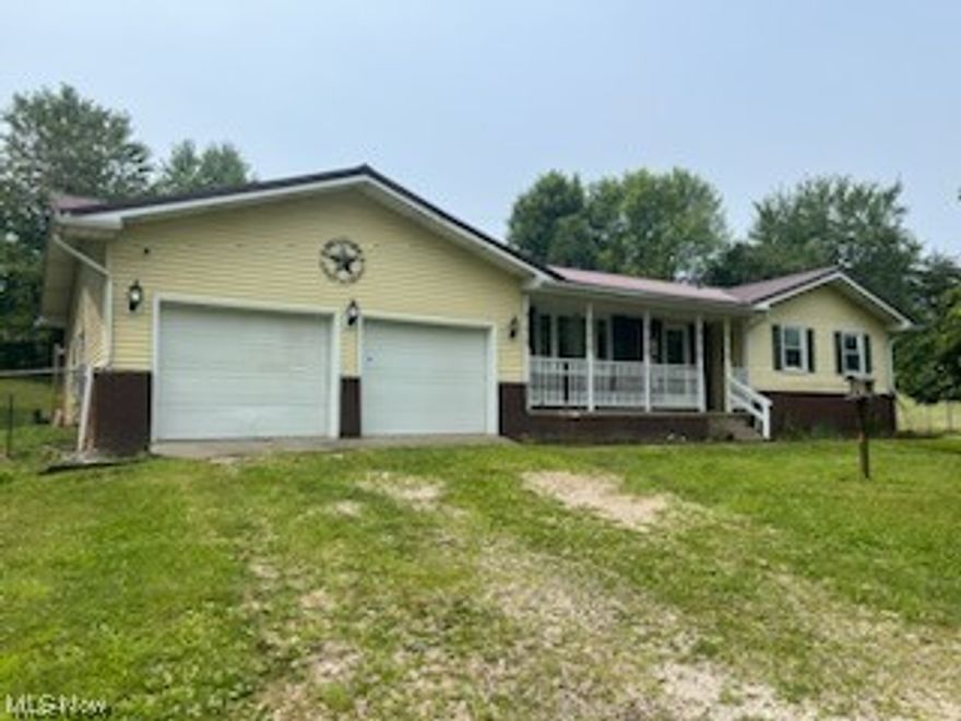Lovely 3 bedroom 2 bath ranch home with 2 car attached garage on 1+ acres in Coolville, OH. Large open floor plan, beautiful stone fireplace, spacious kitchen with granite countertops, security system, fenced in yard and more.