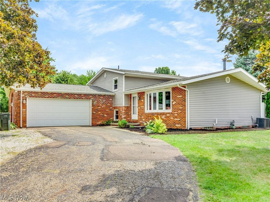 Welcome home! This move-in ready beauty won't let you down. Beautiful sought after cool color palette throughout. An open airy living room with wonderful bay window allows natural light to flow in. The dining room and kitchen have great views of the backyard. Pretty cabinetry in the kitchen with plenty of storage and counter space. Enjoy more living space and snuggle in by the fireplace in the lower level family room. Enjoy your own private basketball court! This is a four level split so storage won't be a problem.