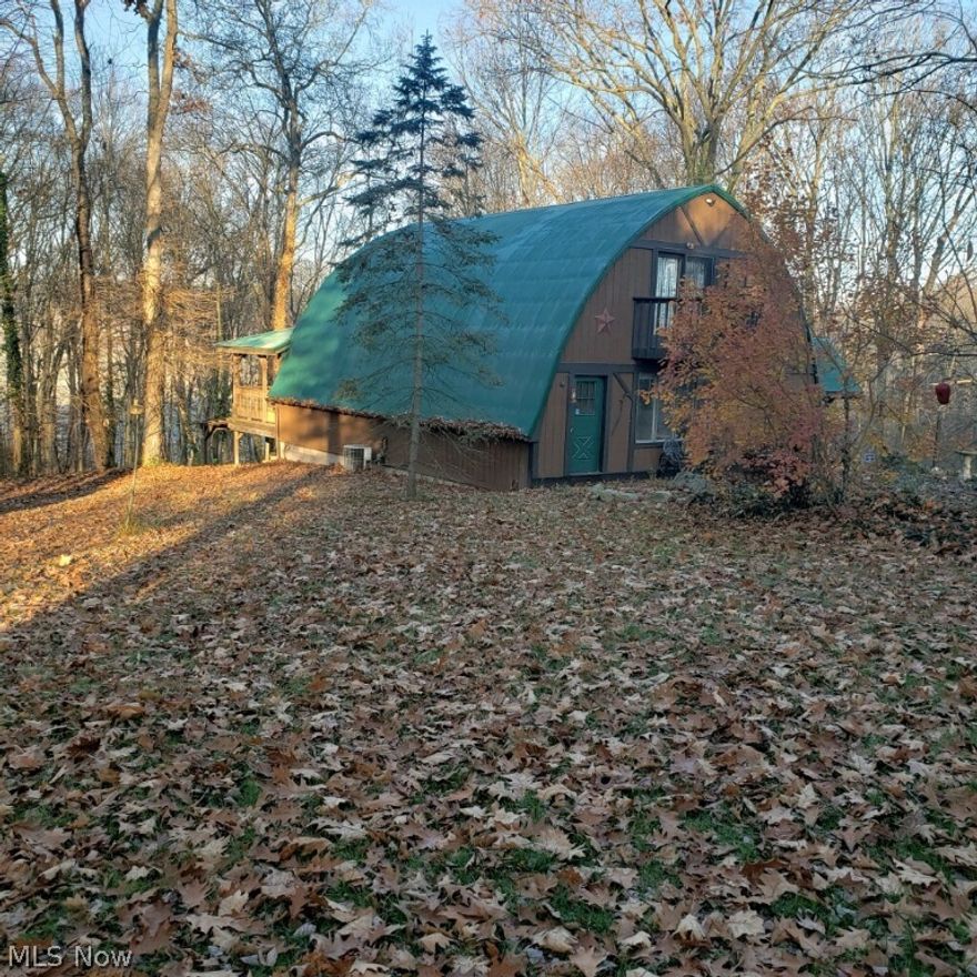 If your looking for peace and relaxation, there is no better place then a retreat in the woods.  Make this beautiful, rustic, unique home sitting on 5.4 acres your permanent retreat. With only one owner this home has been loved and creatively designed.  You will love the gorgeous wood spiral staircase, the open floorplan and windows everywhere giving you the feeling of sitting in the woods but being in the comfort of your living room.  There is 3 bedrooms upstairs in the loft, and all 3 bedrooms include an entire wall of drawers, leaving you more floor space.  The master bedroom includes a full bathroom and walk in closet. The laundry is conveniently located in the loft area, eliminating steps. There is a full walk out basement that can be used for whatever you desire.  Also included is a large garage (24x32) and a large workshop (32x32) This home is also wired for a generator, and plumbed for an out door wood burner.  Security system included. Average electric bill is $100.00 a month.