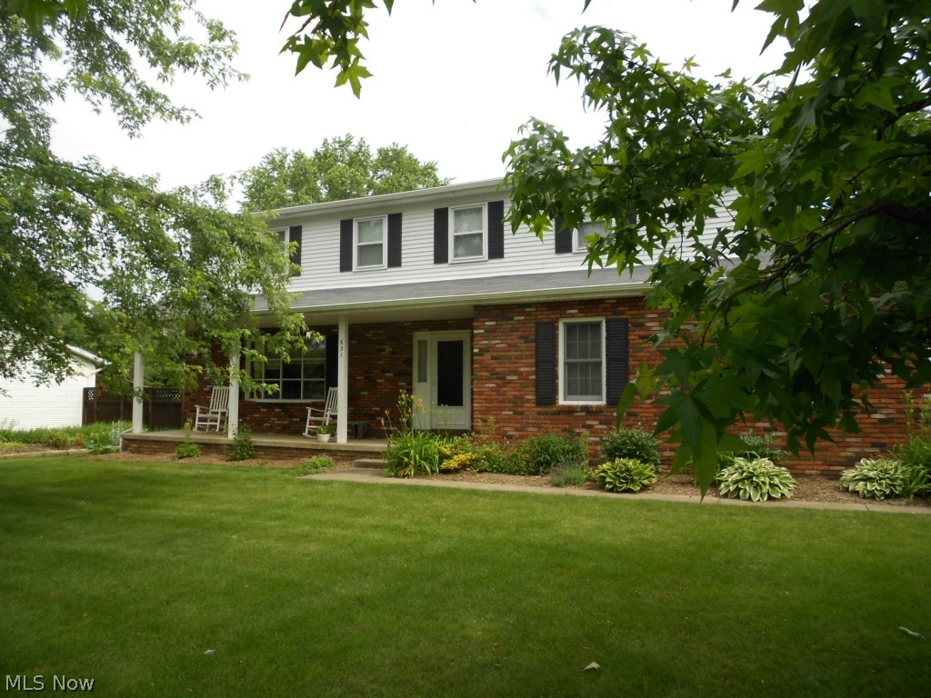 Beautiful four bedroom, two & a half bath colonial in Brook Heights Estates. Spacious living room leads to dining room & renovated kitchen with stunning maple hardwood flooring. Kitchen was remodeled in 2010 & features solid cherry cabinets, granite counter tops & stainless steel appliances. Step down to the inviting family room accented by a brick woodburning fireplace. Sliders open to large screened porch & patio. Upstairs you'll find a spacious master suite with full bath & walk-in closet plus three additional bedrooms & main bath with double sinks. Furnace, C/A & attic fan new in 2012. New carpet both upstairs & down in 2013. 200 AMP electric service upgrade. Storage barn (12 X 14) with cement floor & loft. Home warranty offered. Woodridge schools, great location, this is a home you don't want to miss!