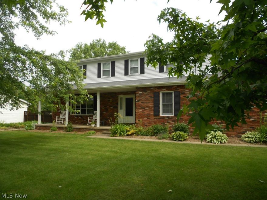 Beautiful four bedroom, two & a half bath colonial in Brook Heights Estates.  Spacious living room leads to dining room & renovated kitchen with stunning maple hardwood flooring.  Kitchen was remodeled in 2010 & features solid cherry cabinets, granite counter tops & stainless steel appliances. Step down to the inviting family room accented by a brick woodburning fireplace.  Sliders open to large screened porch & patio.  Upstairs you'll find a spacious master suite with full bath & walk-in closet plus three additional bedrooms & main bath with double sinks. Furnace, C/A & attic fan new in 2012. New carpet both upstairs & down in 2013.  200 AMP electric service upgrade. Storage barn (12 X 14) with cement floor & loft. Home warranty offered.  Woodridge schools, great location, this is a home you don't want to miss!