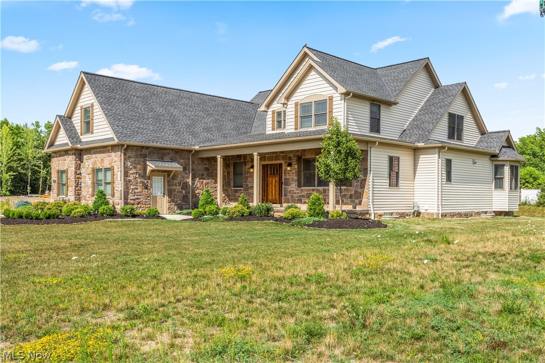 Luxurious custom-built smart home from EFG Custom Homes with updates galore. From the moment you step onto the inviting front porch and through the door, you will be impressed with the attention to detail and quality. The dramatic two-story great room with stone faced gas log fireplace and reclaimed barn wood mantle is the heart of this home. Wonderful open floor plan connects the chef worthy kitchen to the great room and includes a huge island with seating, granite counter tops, custom soft close cabinets, stone tile backsplash, gas cook top, double ovens, walk-in pantry and stainless appliances. Gorgeous hardwood floors and architectural archways plus custom millwork create beautiful formal and informal dining areas and a living room or office space. The large first floor master suite features a tray ceiling, oversized walk-in closet and a spa-like master bath with dual granite counters and sinks, fabulous tiled shower and soaking tub. Upstairs awaits four additional bedrooms and two