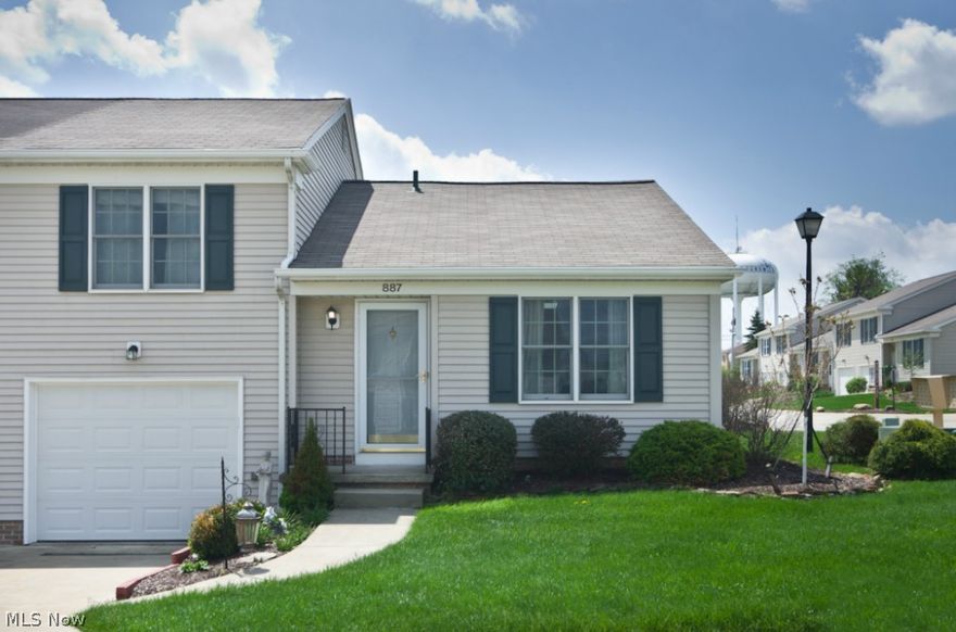 Beautiful cluster home with 2 car tandem attached garage! Vaulted great room with skylight. Many updates throughout including a newer 30 year dimensional roof.   Spacious updated kitchen with ceramic backsplash and sleek appliances. Newer laminate flooring throughout first floor creates that open feel, slider to private fenced in patio. Newer lighting fixtures and faucets throughout! Freshly painted and ready to move right in. Why rent when you can own! Close to Amherst Commons playground!