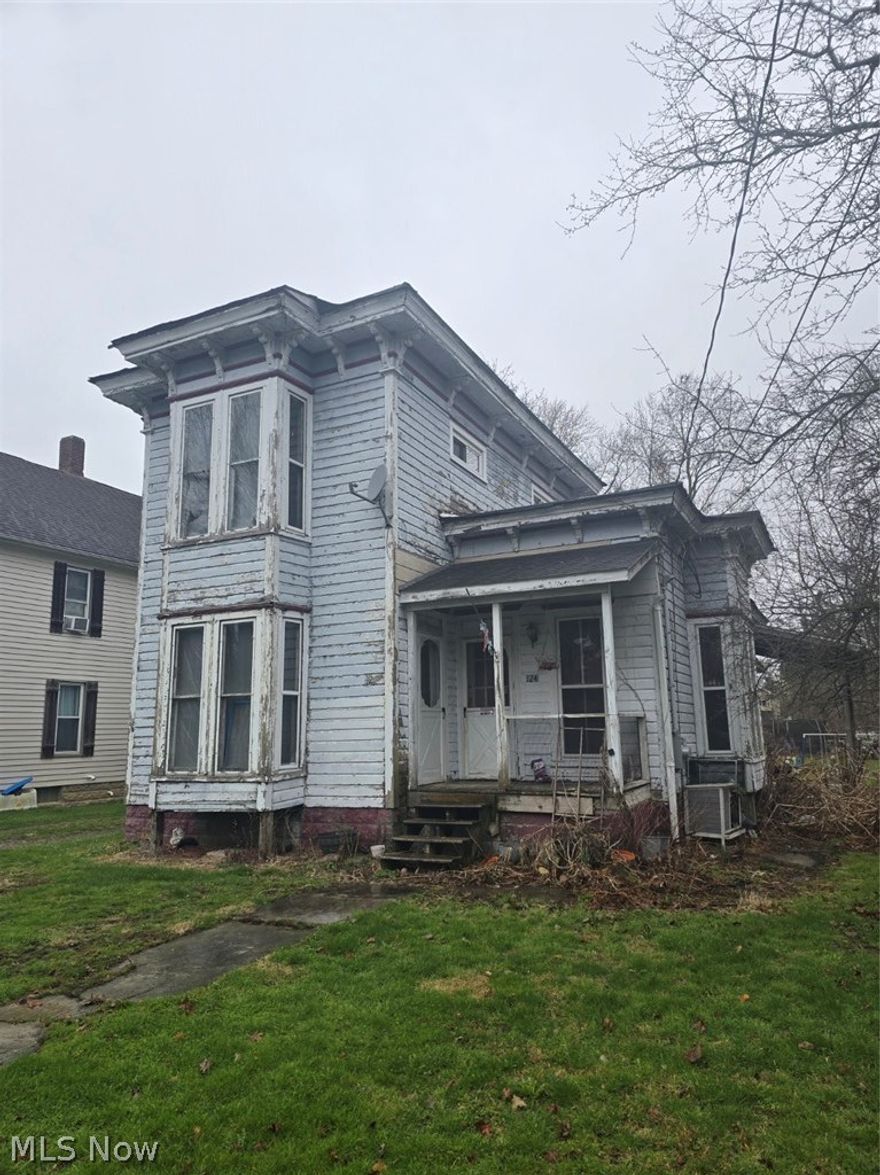 INVESTORS! Come restore this beautiful, large colonial with original wood floors and woodwork. Tall ceilings and big windows allow for natural light all through the house. Main floor laundry, bathroom and two bedrooms. The home has 2 covered outdoor areas and a large backyard for gardening or play area.