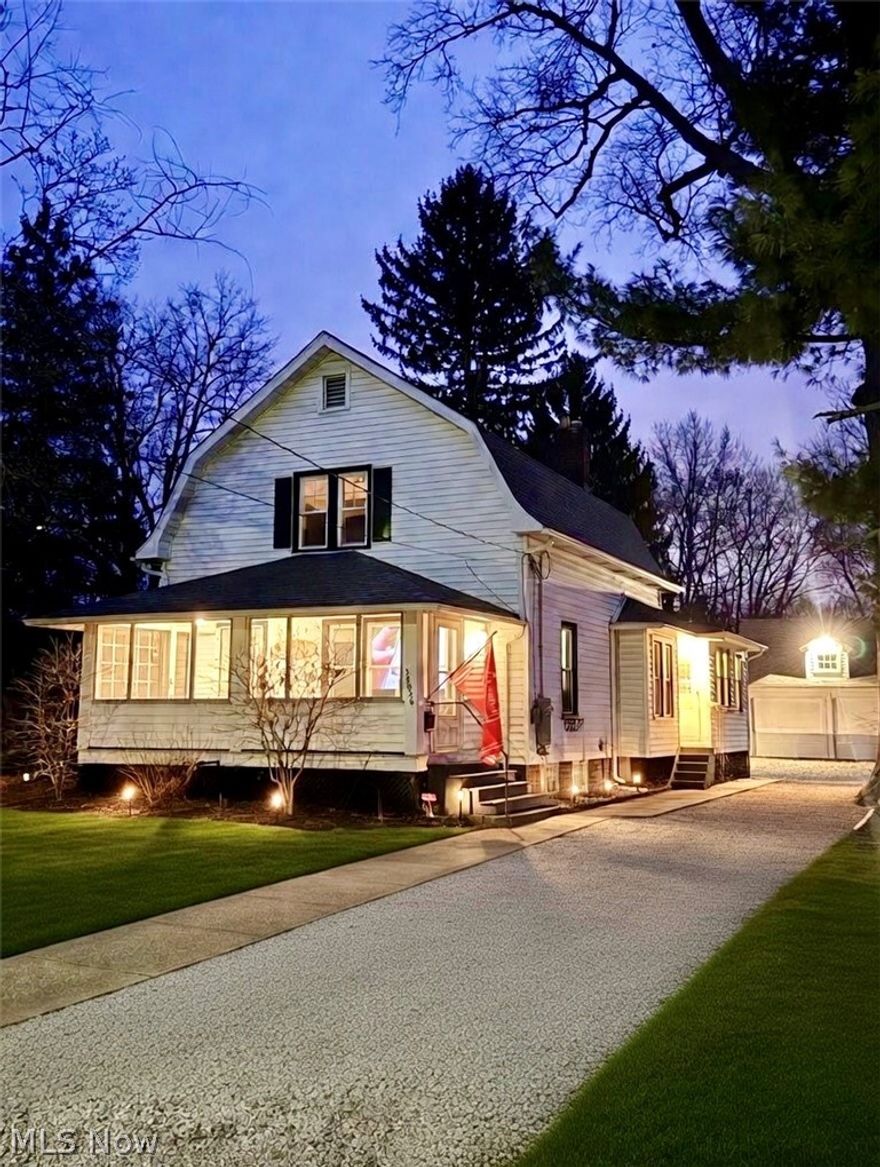 Charming 3-bedroom, 2 full bath home within walking distance to downtown Willoughby. The home is situated on a rare deep lot (62 x 263) with a fully fenced backyard for privacy and brand-new brick paver patio, perfect for relaxing or entertaining. Inside you'll find refinished hardwood floors, an eat-in kitchen with pantry, and a flexible first-floor bedroom with attached full bathroom. Upstairs offers two spacious bedrooms and a beautifully renovated full bath. Major updates include new carpet (2022), new hot water tank (2024), New Windows (2022), and a 2024 HVAC upgrade adding central air to the main floor. Enjoy the cozy enclosed front porch, large attic storage, and unfinished basement. Detached garage includes a separate workshop/craft/play area. All appliances stay, including, second refrigerator in basement,  washer and dryer. Charming home, private yard, and unbeatable location! Come see it before its gone!