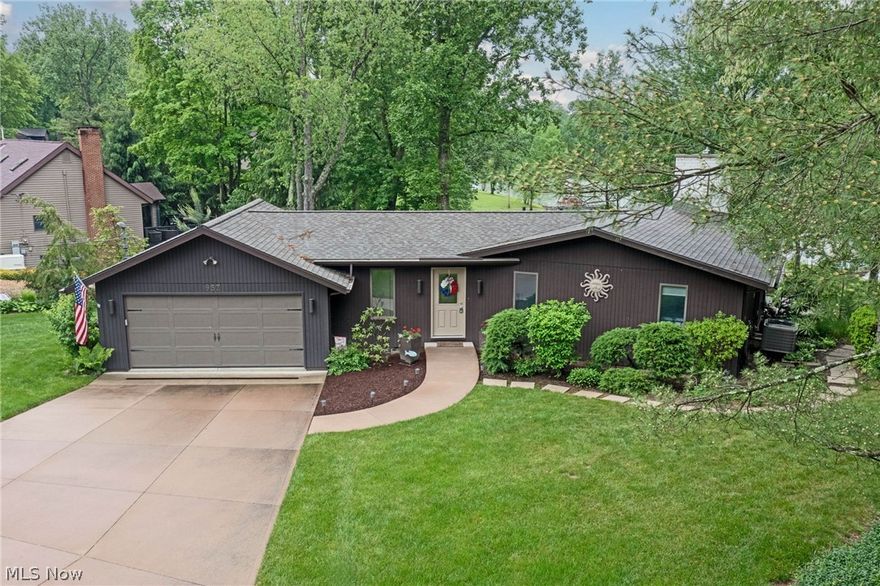 Incredible Charles Mill lake front home with million dollar water views! Enjoy your coffee each morning on the large composite deck - brand new in 2022! Or, walk right down to the lake and head out for a day on the water!  Dock included! Inside this beautiful home you will find a fantastic floorplan with incredible lake views from the updated kitchen and the large great room. Relax at the end of a long day in the primary suite that has a beautiful updated bathroom with dual sinks, tons of storage and step in shower. Many updates in the last 10 years including furnace, a/c, propane fireplace insert, kitchen, appliances, luxury plank flooring, roof, whole house generator, composite deck and railing, gutters/gutter guards and more! Incredible location convenient to I-71 and route 30. Enjoy the lake lifestyle out on the water or with neighborhood events like fireworks over the lake and neighborhood cookouts.  Don’t miss this one!!