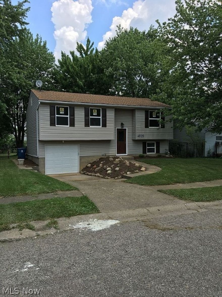 Don't miss the chance to own this beautiful, completely renovated home. The workmanship is exemplary and would make anyone proud to call this their home. Brand new electrical service, furnace, air conditioning, and hot water tank. New kitchen cabinets, tile back splash, lighting and fixtures.  All appliances included in the kitchen (stove, refrigerator, microwave, dishwasher and garbage disposal). Luxury vinyl plank in the living room, kitchen, hallway and upstairs full bathroom. Bedrooms and rec room have new carpet. Newly painted neutral paint in all rooms. New garage door, front door and all windows throughout. Beautiful fenced in back yard with shaded deck.  Perry Local schools. Just move in and enjoy!