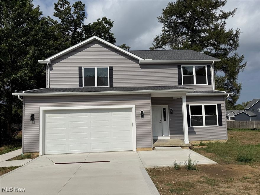 Mentor New Construction! About 2600 sq ft plus a full, unfinished basement. Great colonial layout with entry foyer, office, huge living room, which flows into a spacious dining/kitchen area. Laundry and mud room off the garage, also on the 1st floor. All high-end materials, plywood cabinets (no particle board!) with soft close, dove tail drawers. Upstairs are 4 spacious bedrooms, including a primary bedroom with en-suite bath that includes a huge closet, dual vanities, and soaking tub. Other features: 2-car attached garage, almost .6 acre lot, sliding doors to the back yard, kitchen pantry, tons of storage. Perfect location near shopping, restaurants, schools, freeway access, and more!