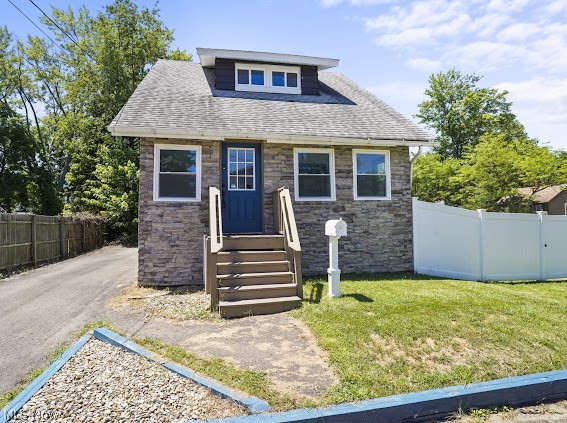 452 Ardella Avenue --- 2 BDR/2 BA with SO MANY updates! Stone exterior finishes. Enclosed front porch. Storage Shed. Fenced in side yard. Corner Lot. Spacious living area. Loads of natural light. All newer vinyl windows throughout. Updated kitchen w/ white cabinets, backsplash, laminate counter tops and a stainless steel range hood. Separate dining room with built-in window storage. LVP & tile flooring throughout. Full bathroom with walk-in titled shower & double vanity. Upstairs you'll find the 2 spacious bedrooms & the additional updated full bathroom with a titled tub & modern vanity. In the basement, there's extra finished space as one could potentially be used as a third bedroom, office space, rec room -- your call! Lots of storage space. Washer and dryer are included. Central air! Other updates include Basement Waterproofing, Paved Driveway, Electrical, A/C, Furnace, HWT, Plumbing, Exterior + Interior Paint & Exterior Doors, Vinyl Fence ('21-'22). Seller is offering a one-year America's Preferred Home Warranty to the buyer for additional peace of mind! Immediate Occupancy! Don't miss out on your opportunity to own a home of your very own!
