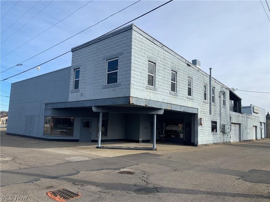 2,030+/- square foot commercial space.  Conveniently located in downtown New Philadelphia. Man door and 12' overhead door.  Warehouse space with restroom.