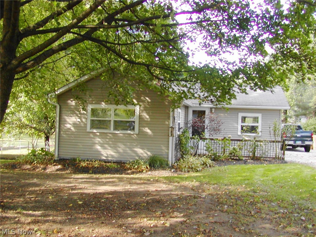 Lot: 100 x 250. Well maintained two bedroom ranch on a large, wooded fenced lot. Newer applianced kitchen with a pantry and lots of cupboards, replacement windows, wood burning fireplace in the living room. Bathroom was recently updated. Waterproofed basement. Washer and dryer also stay. Two storage sheds stay. One is 14' X 14' with a loft, the other is smaller. Newer hot water tank- 2019, central air- 2014. America's Preferred Home Warranty included.