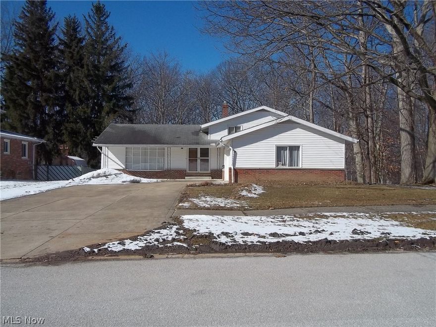 Welcome to this amazing split level home in Parma. This home features three large bedrooms, two full baths, large living room, formal dining room, large eat-in kitchen that over looks a family room with a gas fireplace. Looking out from the patio doors there is a beautiful view of the wooded backyard. There is a room off the family room that can be a playroom or home office. The basement has area for a recreation room and a workroom with a large work bench, also a shower. This home features fresh painted rooms and hardwood floors throughout. There is a large two car garage with new door and opener. This home also features a home warranty. Schedule a showing today, do not miss your chance to make this house your home.