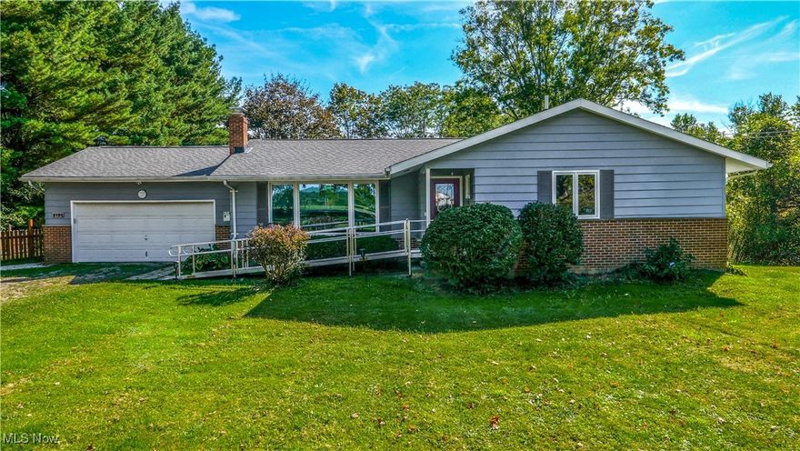 Welcome to this charming home nestled on 2 acres of park-like land, offering the perfect blend of privacy, natural beauty, and modern comfort. The backyard is a true retreat, with mature trees including red oak and apple trees, and direct access to the scenic Buckeye Trail. A partially fenced yard provides both functionality and charm, while a spacious 16x16 composite deck off the sliding door is perfect for relaxing or entertaining. A large shed with lean-to adds plenty of outdoor storage. Inside, you’ll find warm wood floors throughout and a spacious living room featuring a large picture window that floods the space with natural light and a cozy wood-burning fireplace. The modern kitchen boasts a stylish tile backsplash, included appliances, and a large pantry just steps away. Upstairs offers three spacious bedrooms and a generous full bath, along with a private full bath off the primary bedroom. The lower level expands your living space with a partially finished area that includes a second living room, bedroom, and full bath — ideal for guests. The basement also offers abundant storage, a walk-out storm cellar, and has been recently waterproofed for peace of mind. A two-car attached garage completes this fantastic property. This home combines comfort, charm, and natural surroundings in one beautiful package — a must-see!