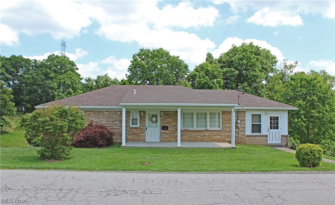 Warm and welcoming! This immaculate 3BR, 1.5 BA stone ranch is just what you're looking for! Situated on .75 acre this home is in move-in condition, Gas heat, central air, new roof, updated kitchen, gleaming hardwood floors throughout, a wonderful enclosed side porch and storage galore! You can't miss the opportunity to see this home before it's gone!