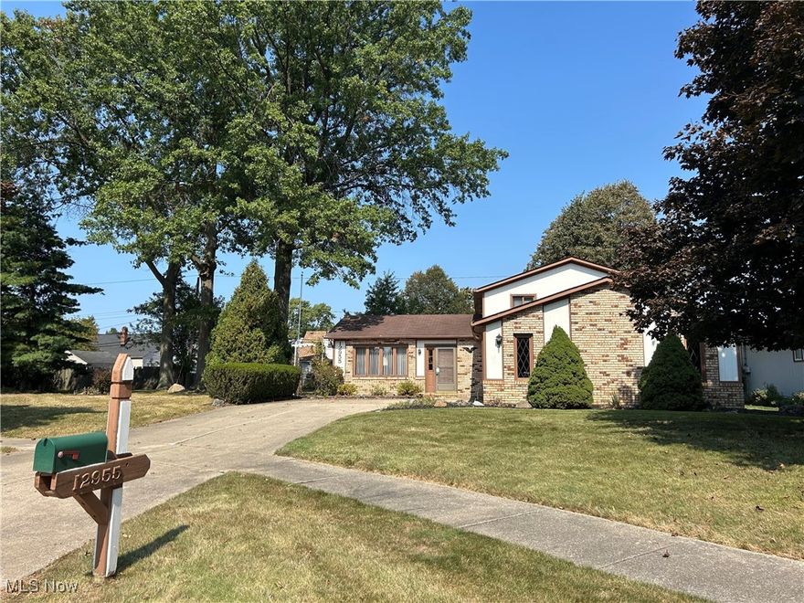 Classic Split Level Home located at the end of a quiet cul de sac being sold with adjacent buildable lot.  Exterior is brick, cedar and aluminum siding.  Main level consists of a large living room, dining area with wood laminate flooring and sliders to backyard.  The kitchen also has wood laminate flooring, a skylight, granite countertops and all appliances stay.  Upstairs the primary bedroom has his & her closets, a ceiling fan and the ensuite bathroom has a shower stall.  The 2 additional bedrooms have ceiling fans and another full bath complete the upper level. The lower level offers an extra large family room with recessed lighting, a gas fireplace and ceiling fan; a half bath and the laundry room offers a shower stall - washer & dryer stay.  The 2 car garage is extra wide offering room for a work bench and has a hot & cold water spigot and pull down storage above garage.  Outside you'll find a large 2 tier deck - partially fenced yard, sprinkler system and nicely landscaped lot.  Same owner for the last 35 years - Bring your decorating ideas!