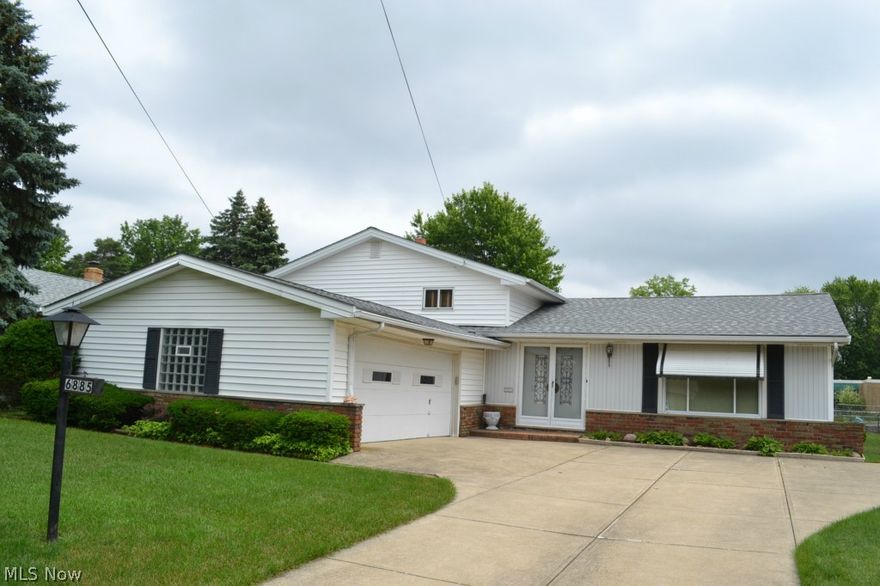 Move right in! Great Curb appeal!  This spacious 3 bedroom, 2 bath home with attached 2 car garage and fenced yard has lots to offer! **Updates include: Furnace, A/C, Roof, Freshly painted foyer and bedroom, Nature Stone garage floor, H2O Tank, Electrical & Main bath has Bath Fitter tub and tile walls.  3 nice sized bedrooms with double closets and beautiful hardwood floors. Spacious and bright L- shaped Living and Dining room. Eat in Kitchen with all appliances. Lower Level family room with half bath is perfect for entertaining and has access to large backyard and patio. Easy to show!