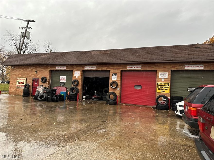 Large 4,725 sq ft steel framed auto repair garage, auto/vehicle storage facility, or tire repair facility with two (2) offices, a bathroom, outdoor parking, and signage. There are 4 garage bays on one half of the building with a lift and access to the offices and bathroom. A door leads to the other half of the building with is vehicle storage. Building has a couple of security cameras and heaters (need repair), and an old compressor. Great condition!